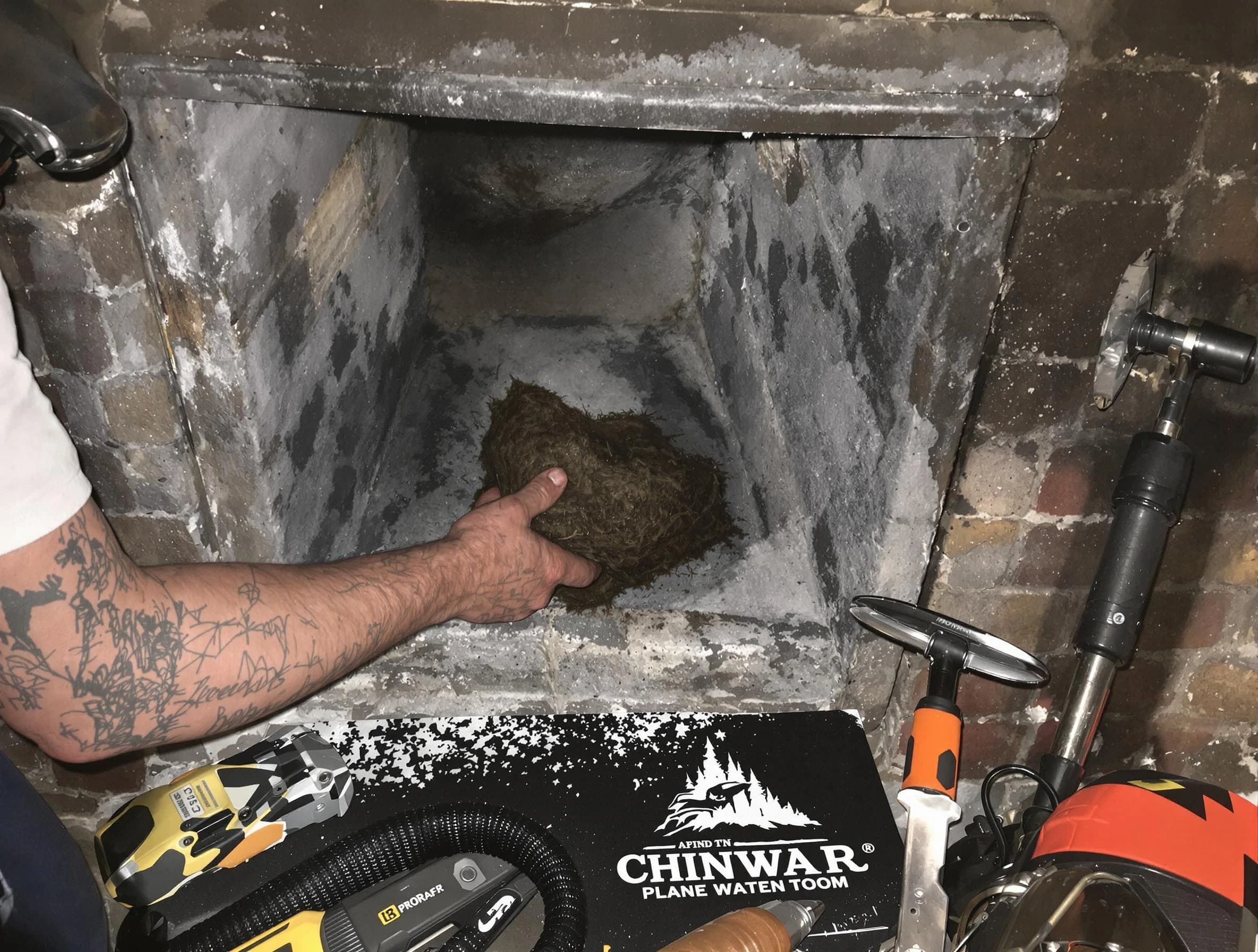 Freehold Chimney Sweep safely removing debris and screening chimney in Freehold, NJ